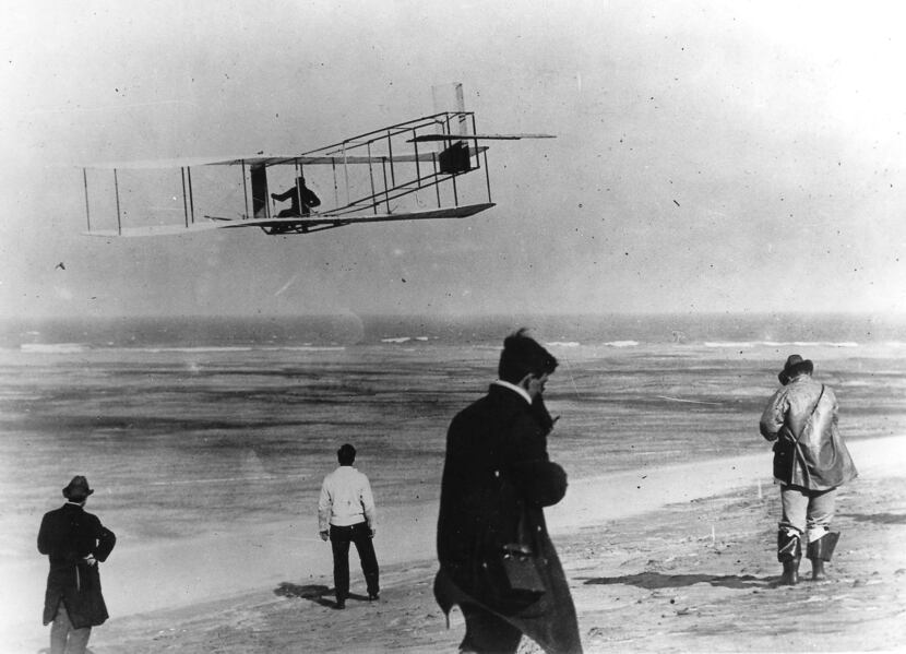 In this undated file photo, Orville and Wilbur Wright test their airplane on a beach. The...