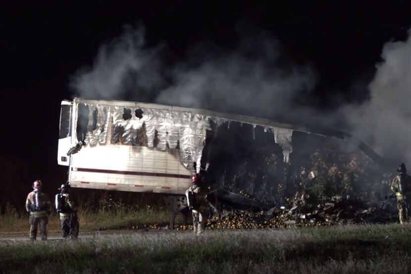 An 18-wheeler sits smoldering in Grapevine after it caught fire Tuesday morning.