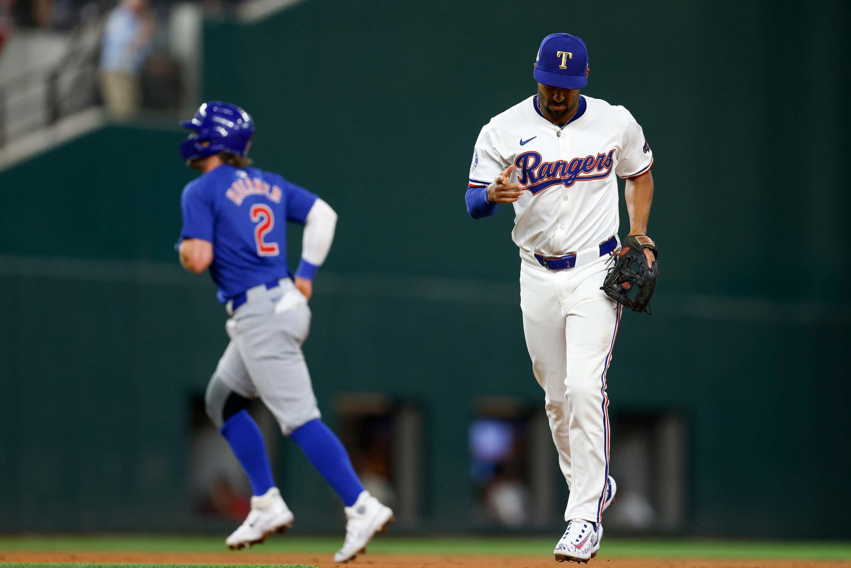 Texas Rangers second baseman Marcus Semien (2) reacts after turning a double play during the...