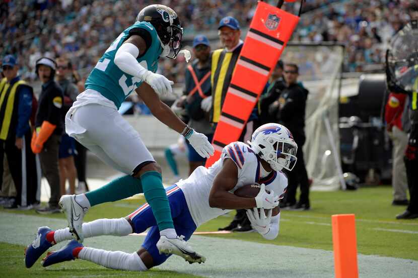 Buffalo Bills wide receiver Emmanuel Sanders, right, makes a reception in front of...