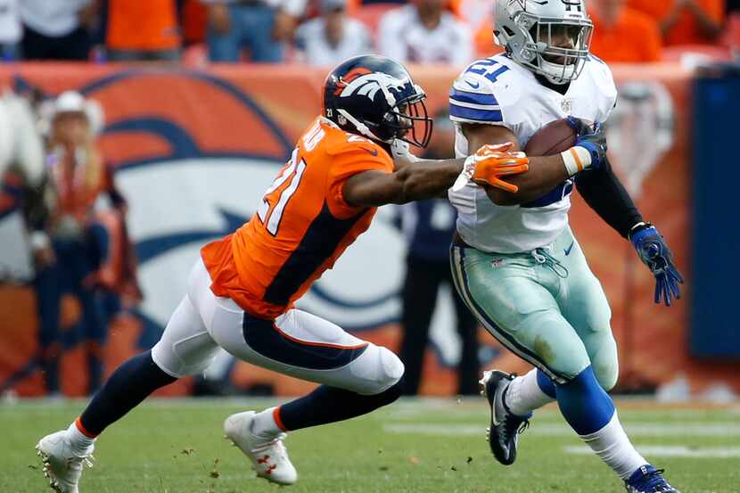 Dallas Cowboys running back Ezekiel Elliott (21) runs the ball against Denver Broncos...