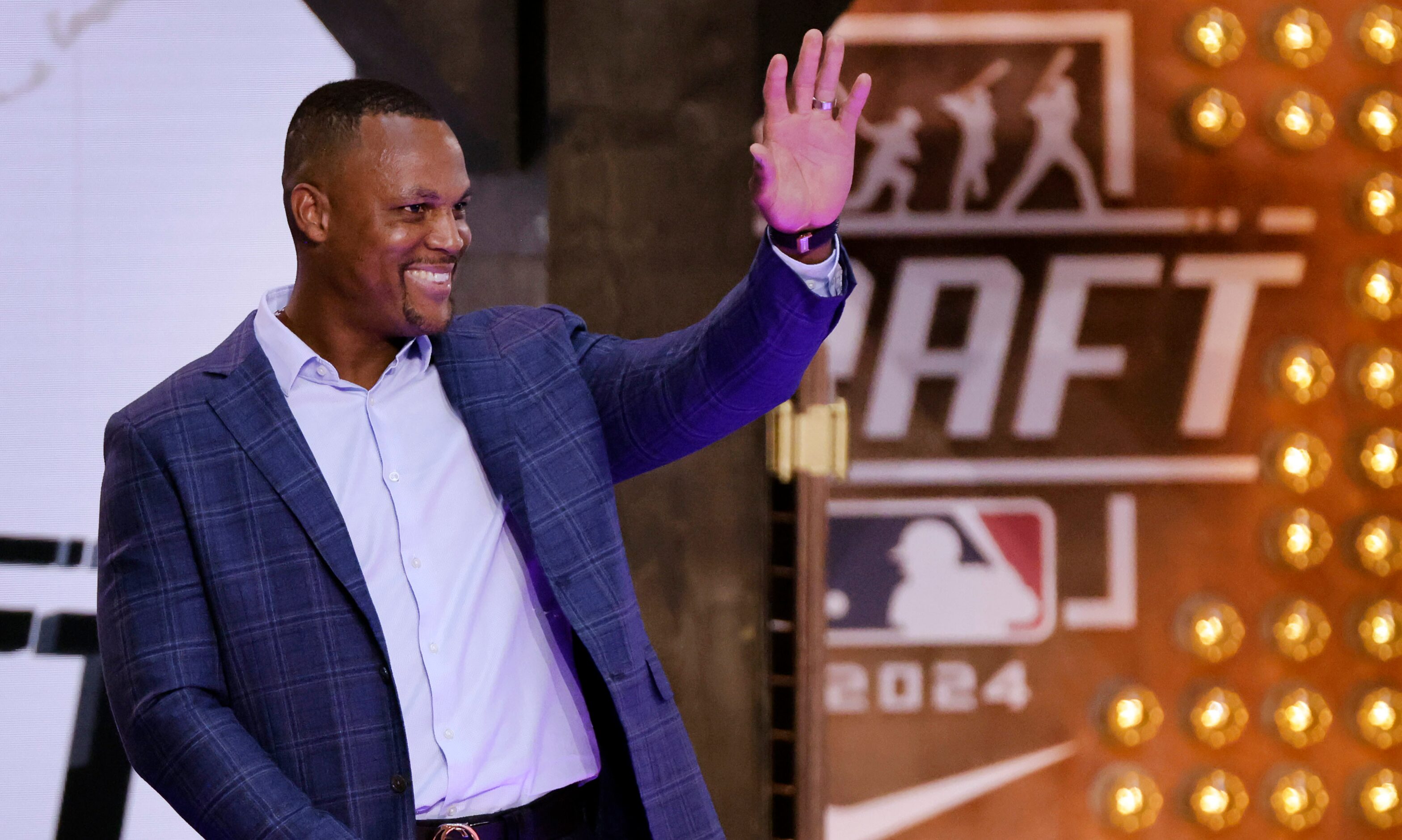 Texas Rangers newest Hall of Famer Adrian Beltre waves to fans he’s introduced before Day 1...