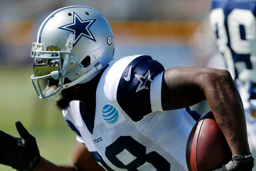 The fields of training camp are reflected in Dallas Cowboys wide receiver Dez Bryant's face...