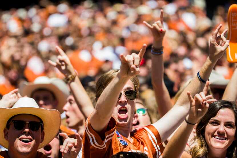 Texas Longhorns fans cheer in the stands during the third quarter of the 2016 AT&T Red River...