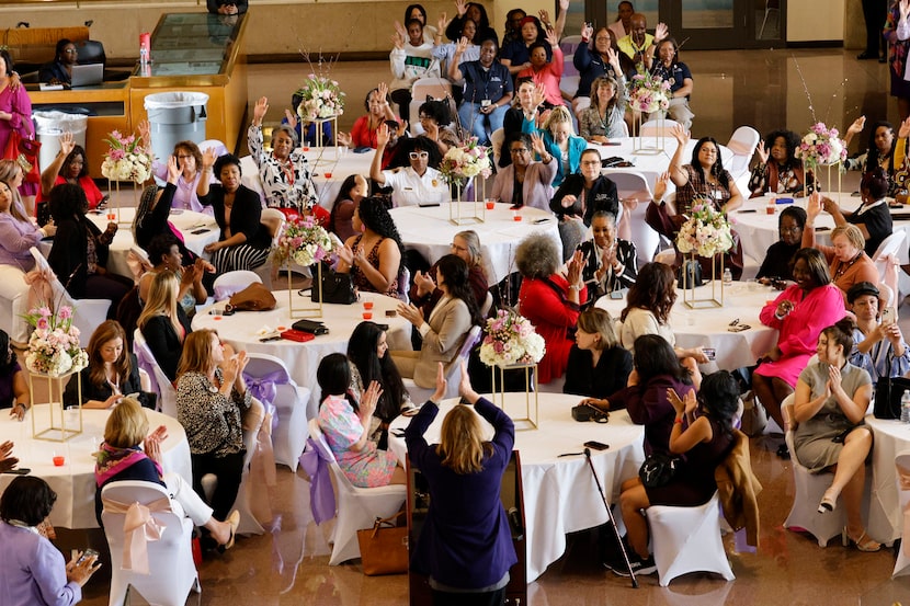 Council member Jaynie Schultz, District 11, foreground center, claps during the fifth Annual...