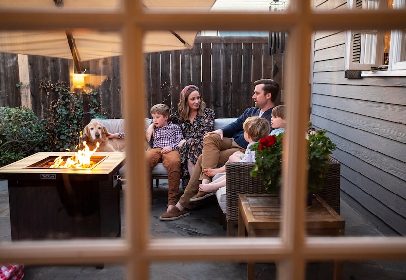 Jessica Barfield, left, and her husband Blake Barfield, with their sons, Henry, 7, left,...