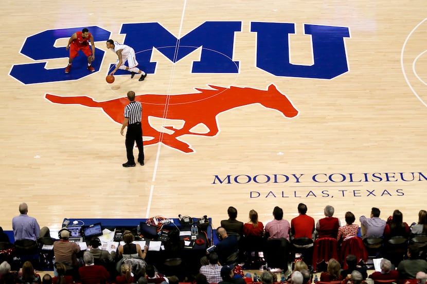 SMU guard Nick Russell (12) defends against Shabazz Napier (13) during SMU vs. Connecticut...