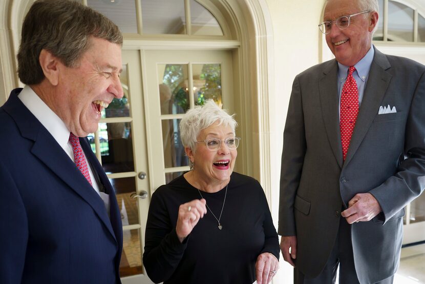 Carolyn Miller laughs with her husband David Miller (right) and SMU president R. Gerald...