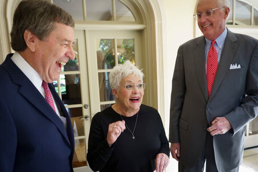 Carolyn Miller laughs with her husband David Miller (right) and SMU president R. Gerald...