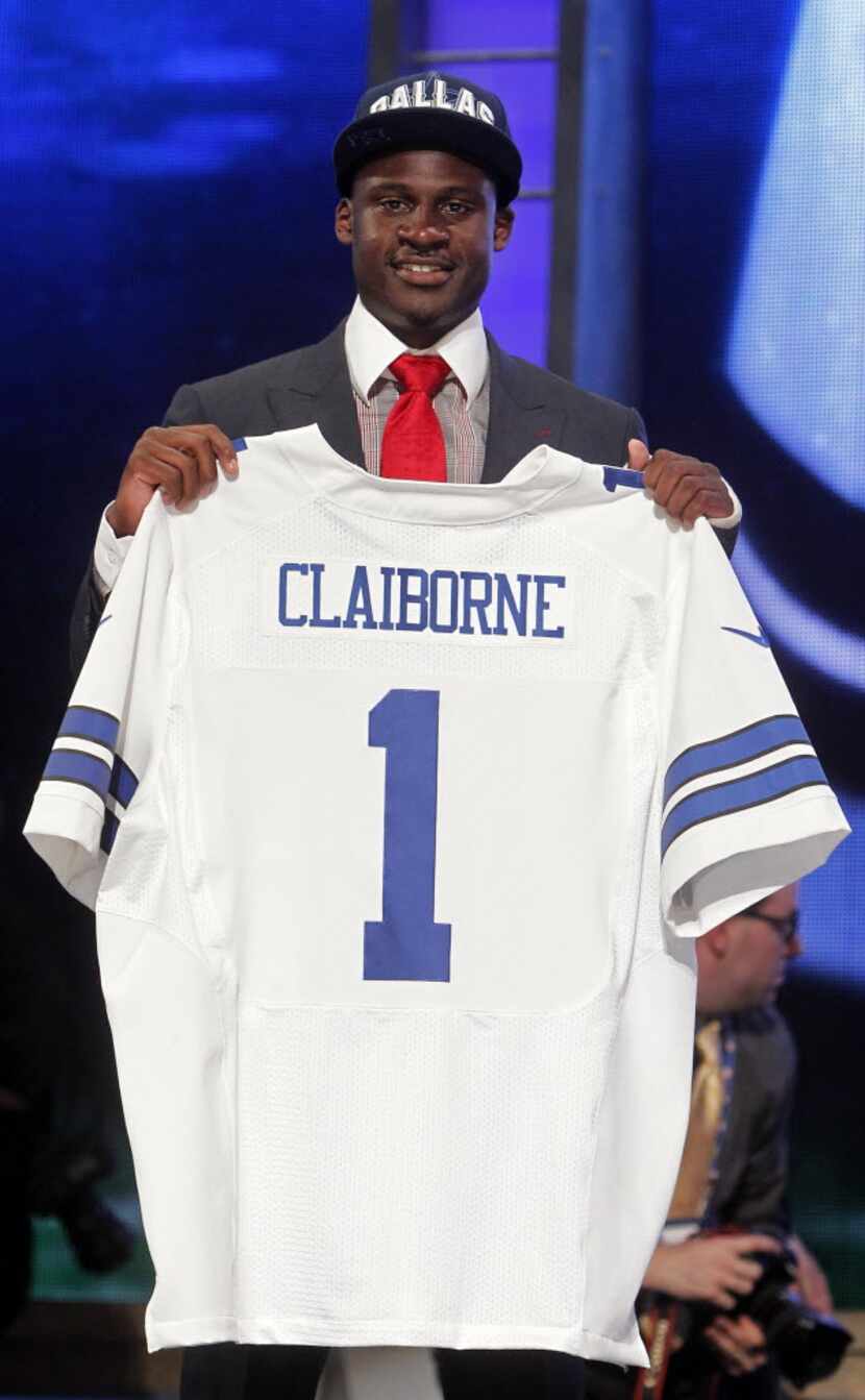 LSU cornerback Morris Claiborne poses for photographs after being selected as the sixth pick...