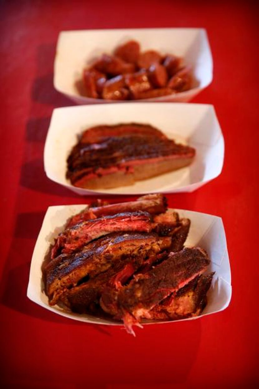 
Bowls full of smoked ribs (bottom), brisket, and sausage at Pit Stop BBQ
