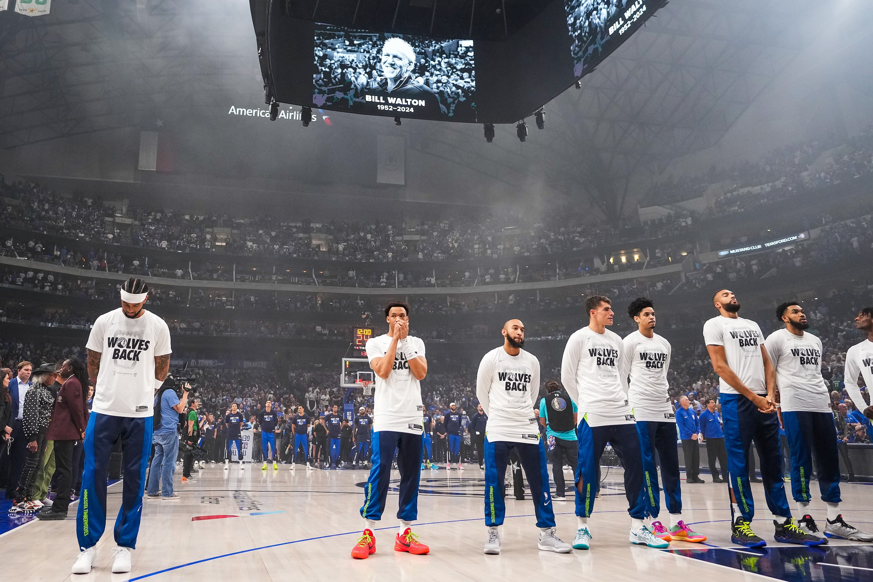 Minnesota Timberwolves players observe a moment of silence for NBA legend Bill Walton before...