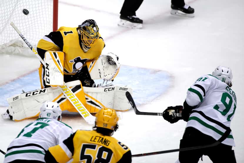 Pittsburgh Penguins goaltender Casey DeSmith (1) blocks a shot by Dallas Stars' Tyler Seguin...