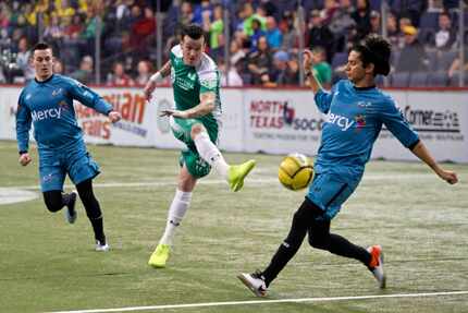 Dallas Sidekicks midfielder Jamie Lovegrove moves the ball forward versus the St. Louis...