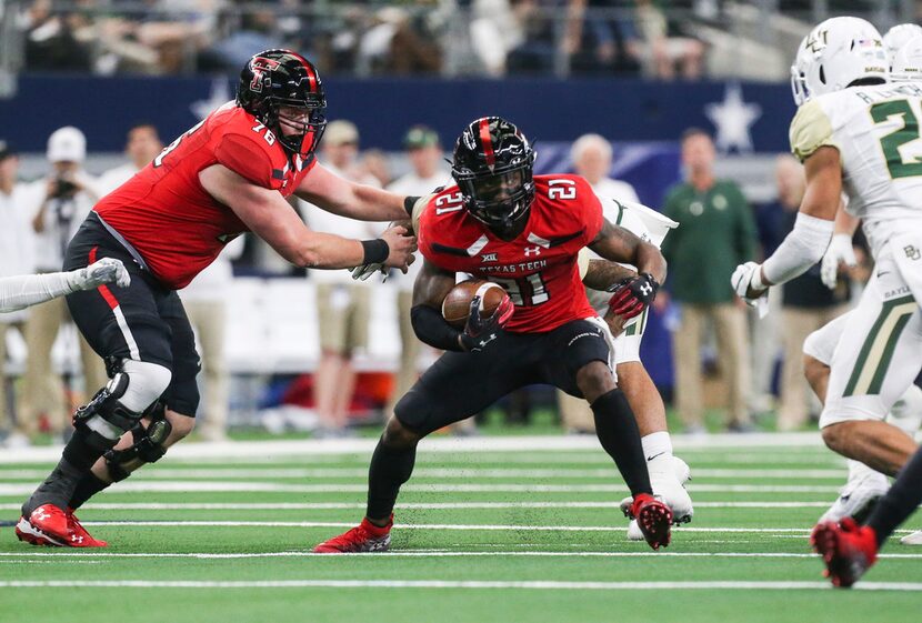 Texas Tech Red Raiders running back Da'Leon Ward (21) makes a run during the second half of...