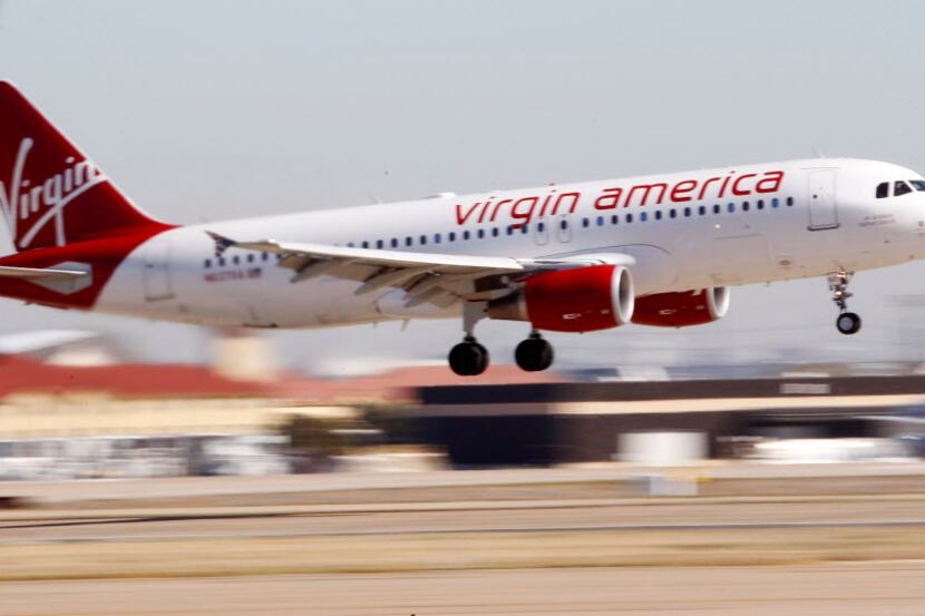  FILE - In this Dec. 1, 2010, file photo, Virgin America's inaugural flight between Los...