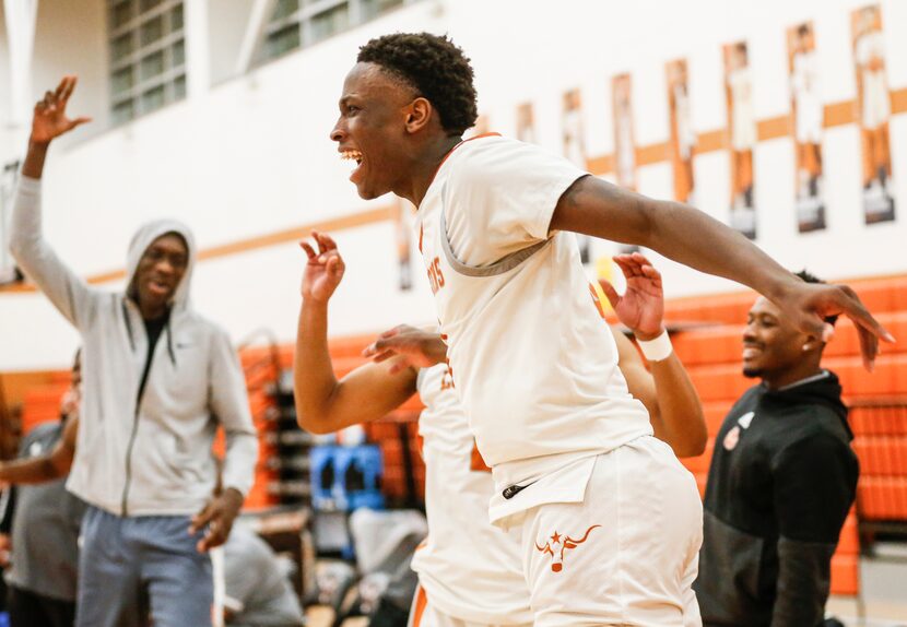 W.T. White High School Charles Fofanah (3) reacts as a teammate scores in the fourth quarter...