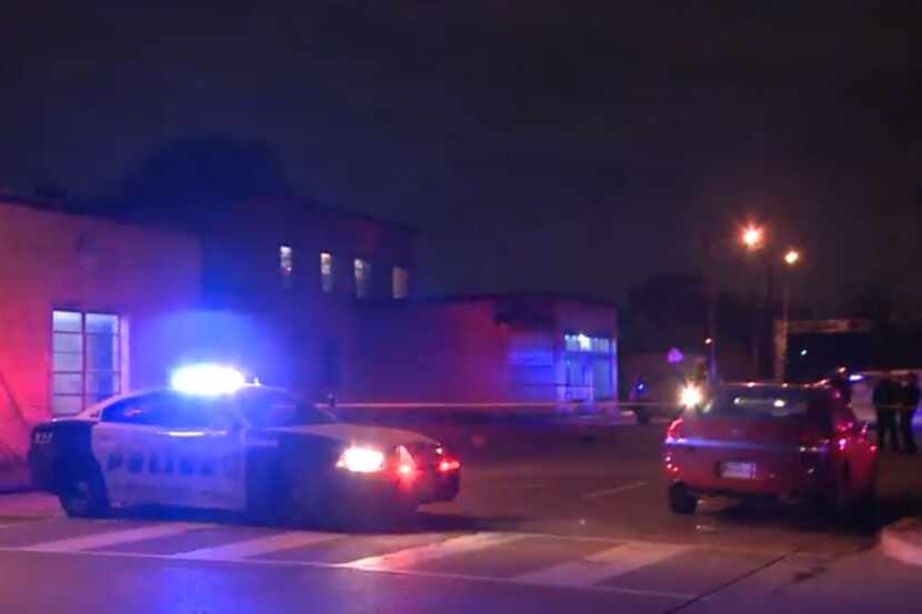A Dallas police squad car blocks traffic near the Bama Pie Company building, which was...