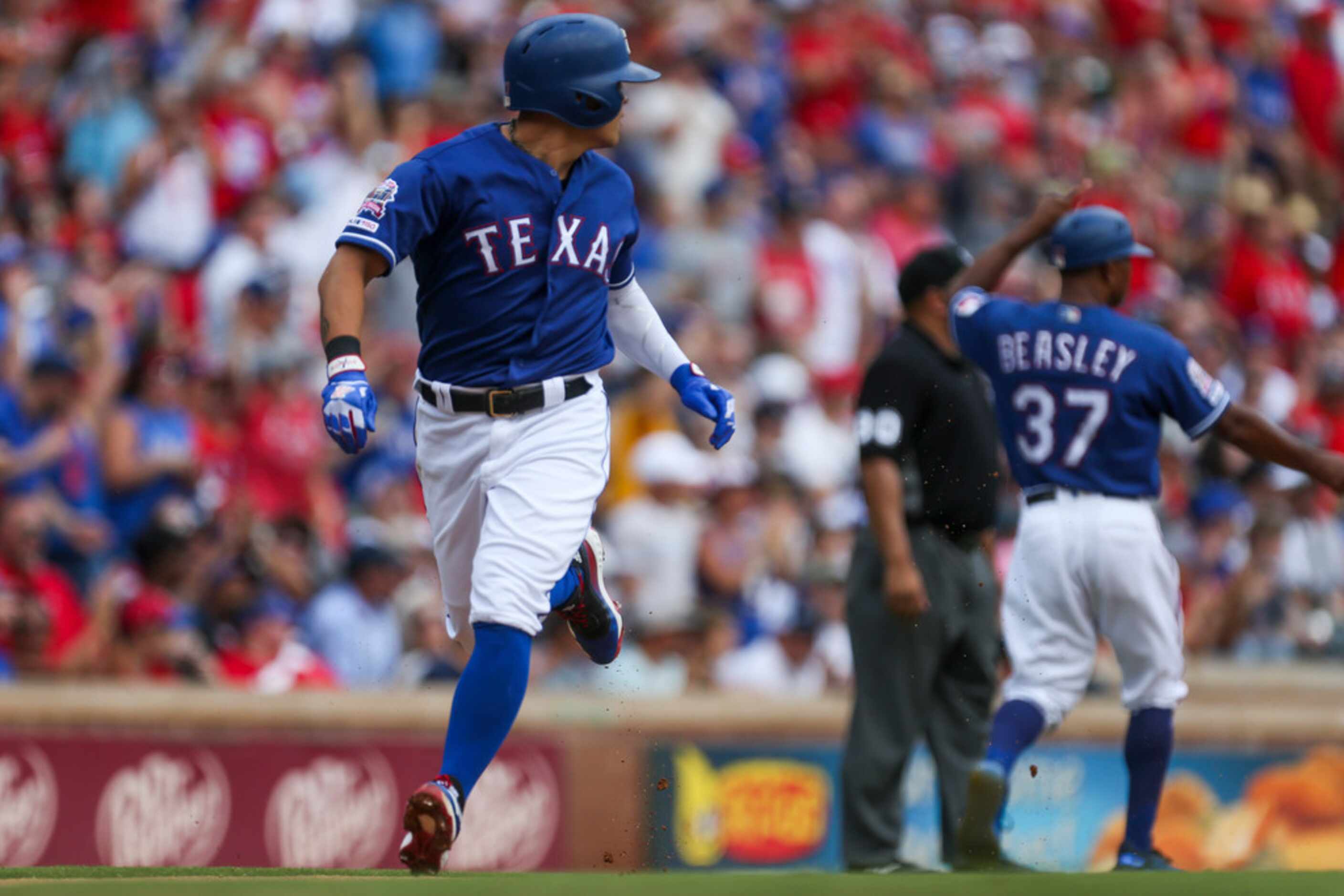 Texas Rangers left fielder Shin-Soo Choo (17) runs home during the first inning of a MLB...