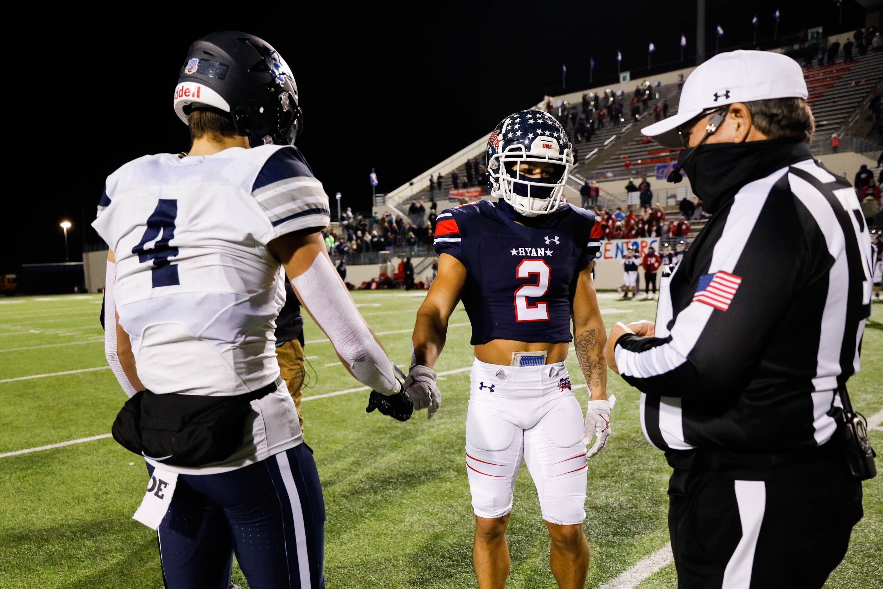Frisco Lone Star's Trace Bruckler (4) and Denton Ryan's Billy Bowman (2) shake hands during...