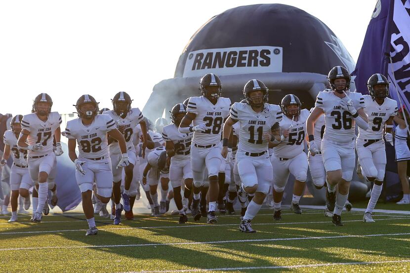 The Frisco Lone Star Rangers enter the field to face Frisco Reedy in a high school football...