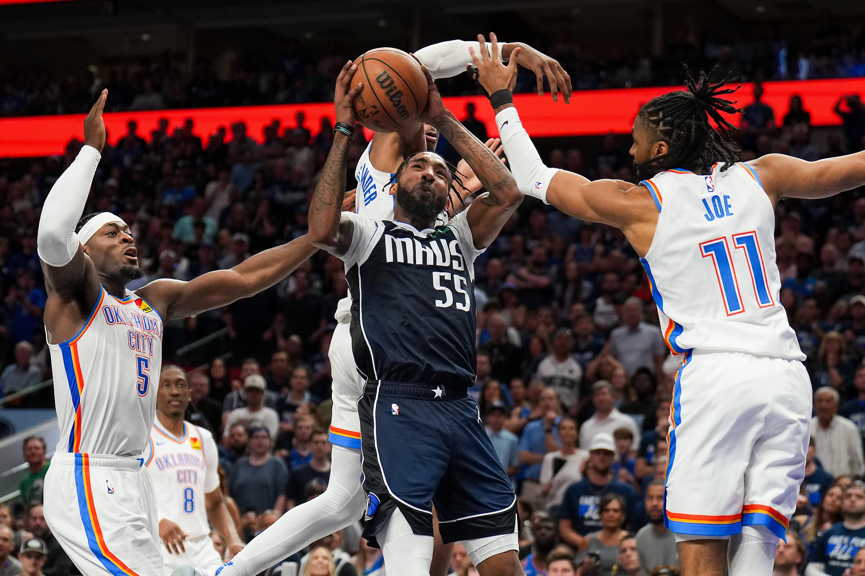 Dallas Mavericks forward Derrick Jones Jr. (55) drives to the basket as Oklahoma City...