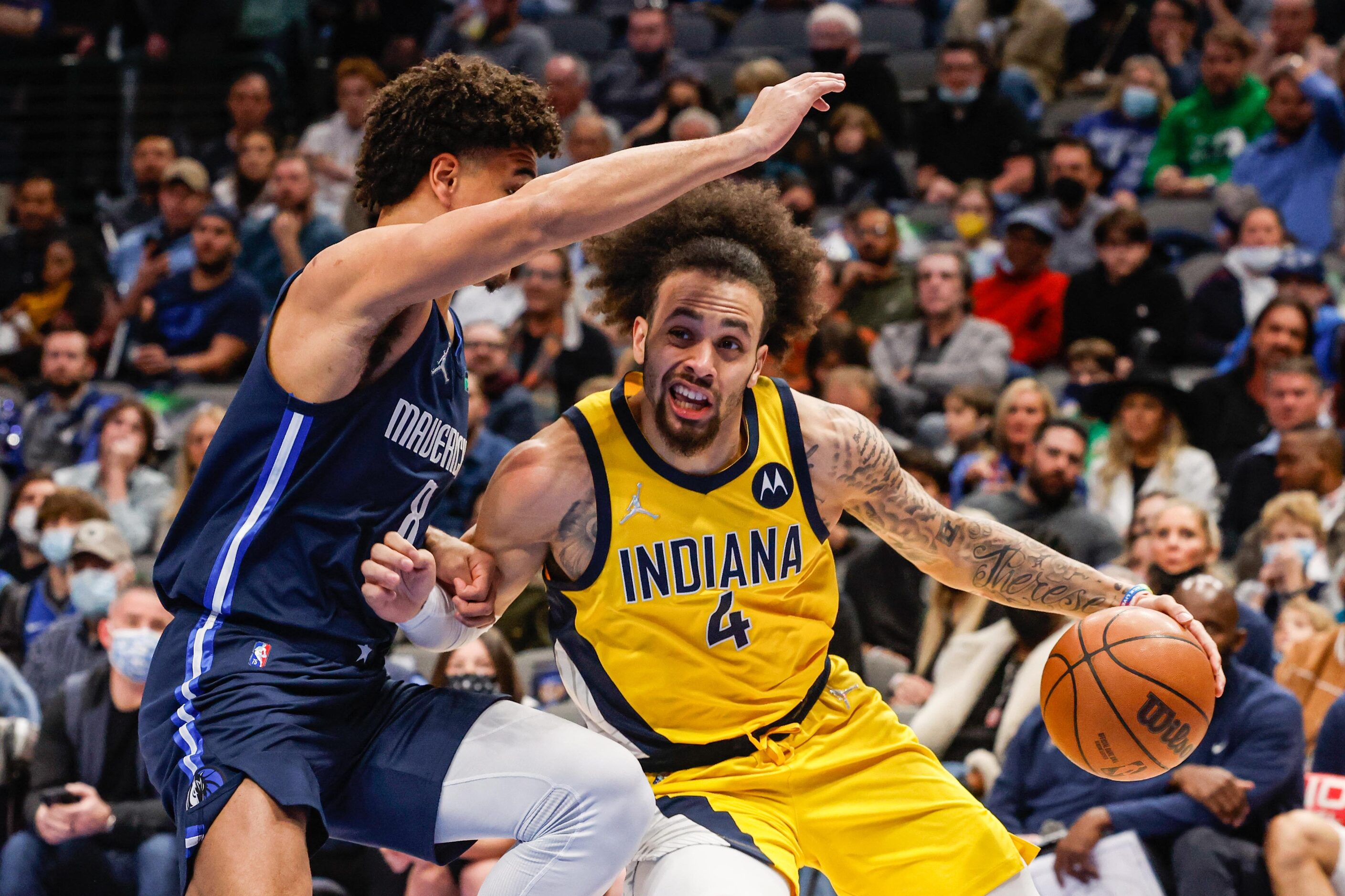 Indiana Pacers guard Duane Washington Jr. (4) protects the basketball against Dallas...