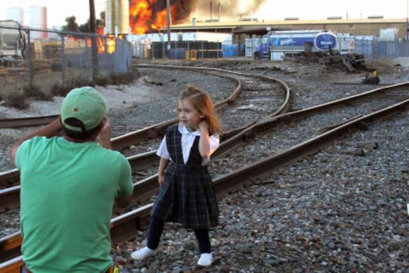 Kevin Cromer snapped a photo of his daughter Cason Cromer as flames and smoke filled the sky...