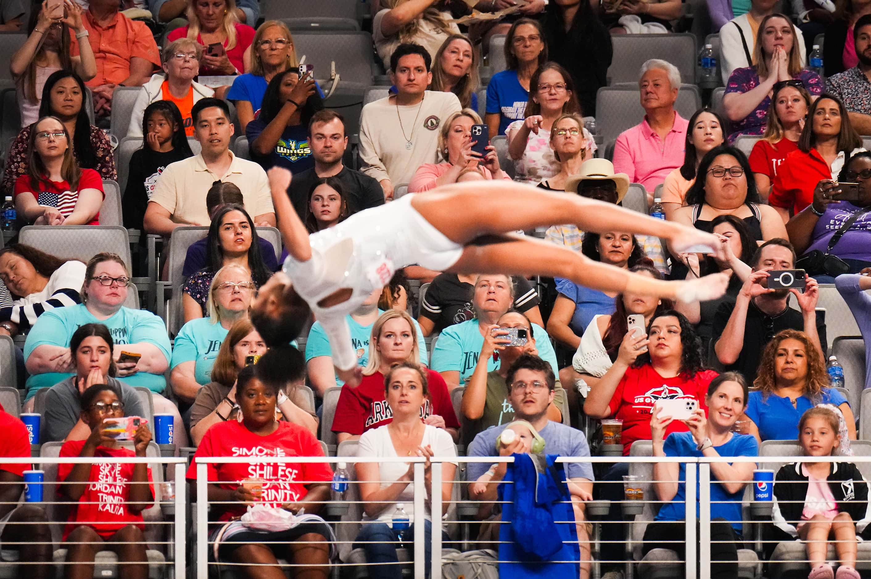 Fans watch as Skye Blakely competes on the vault during the U.S. Gymnastics Championships on...