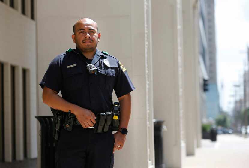 Dallas police Officer Jorge Barrientos poses for a portrait near El Centro College in...