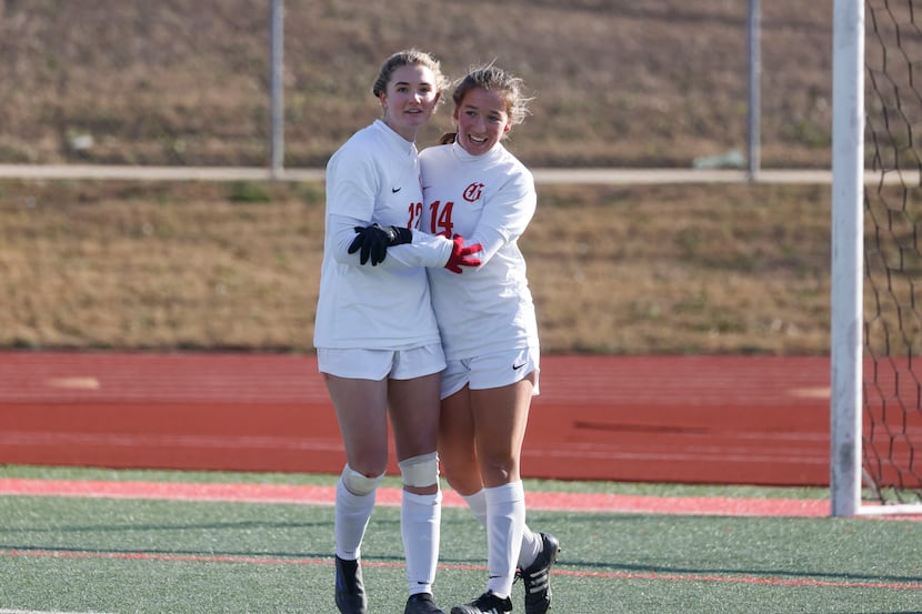 Grapevine's Theresa McCullough (right) and Samantha Larsen, pictured celebrating a goal...