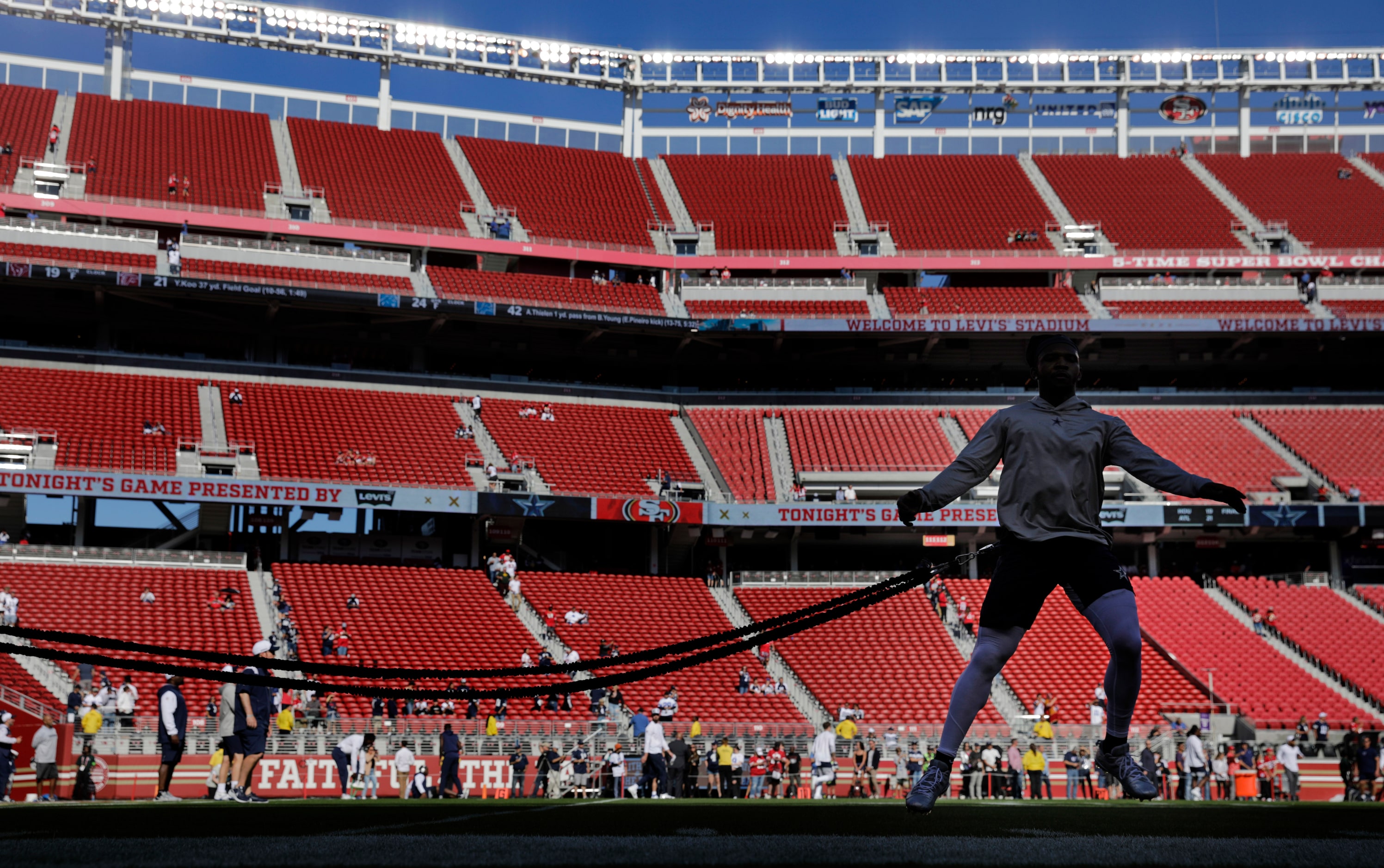 Dallas Cowboys wide receiver Michael Gallup (13) warms-up on the exercise cord during...