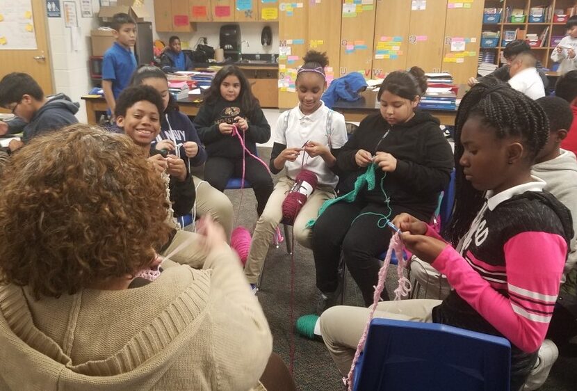 Some of Charlotte Geisler's fifth-grade students at Wilmer-Hutchins Elementary School work...