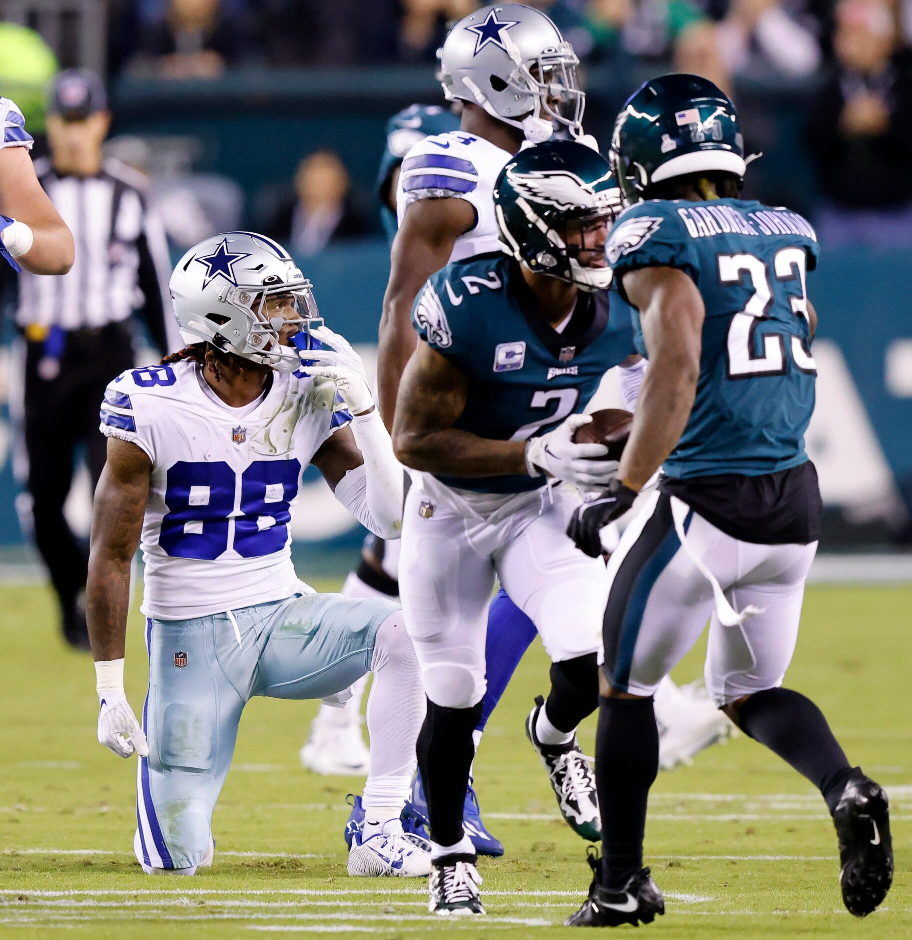 Dallas Cowboys wide receiver CeeDee Lamb (88) gets up after tackling Philadelphia Eagles...