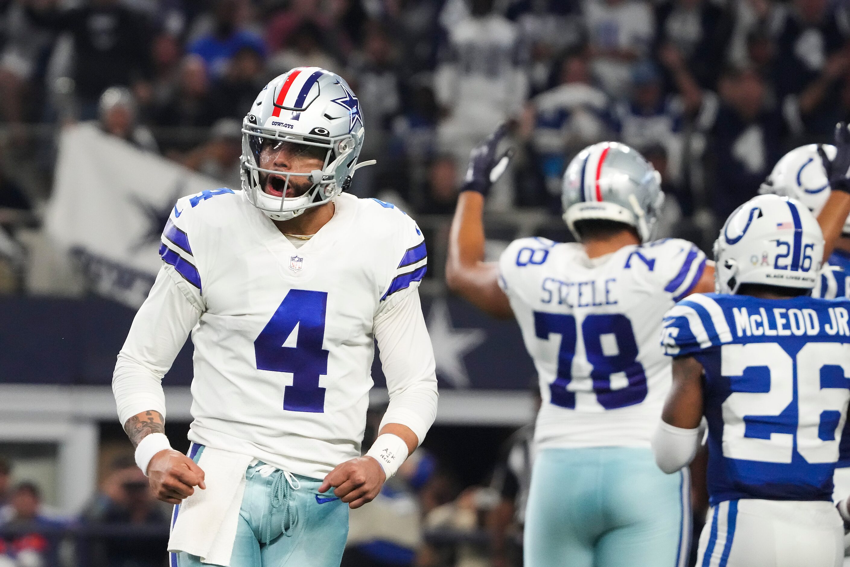 Dallas Cowboys quarterback Dak Prescott (4) celebrates a touchdown run by running back Tony...