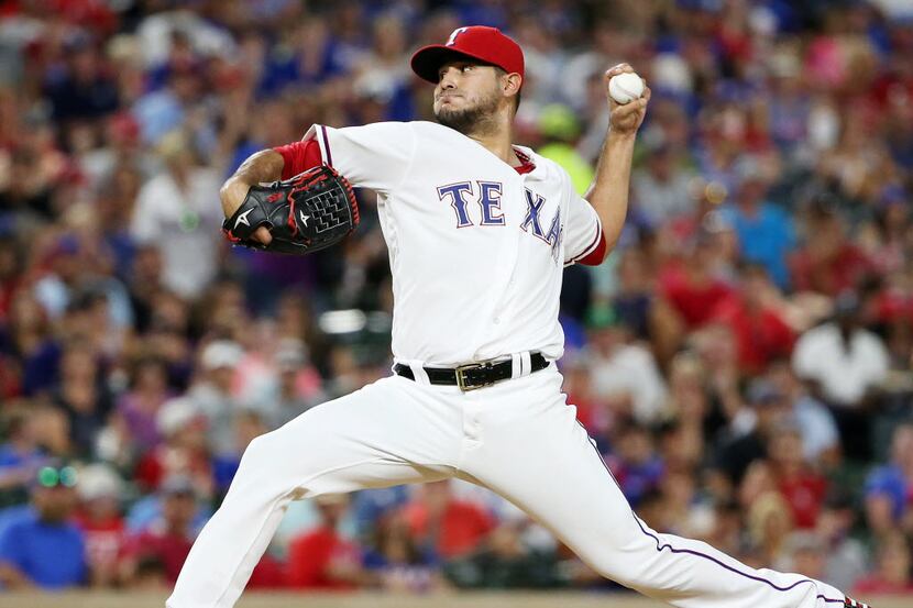 Texas Rangers starting pitcher Martin Perez (33) pitches during a Major League Baseball game...