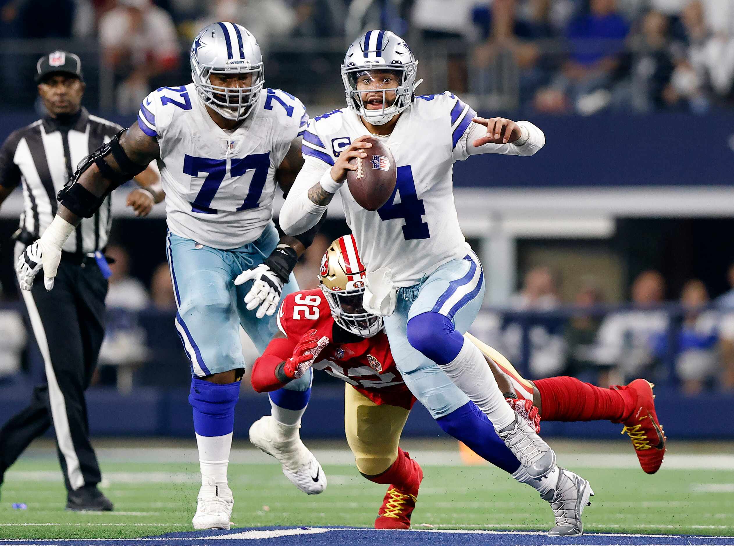 Dallas Cowboys quarterback Dak Prescott (4) scrambles away from San Francisco 49ers...