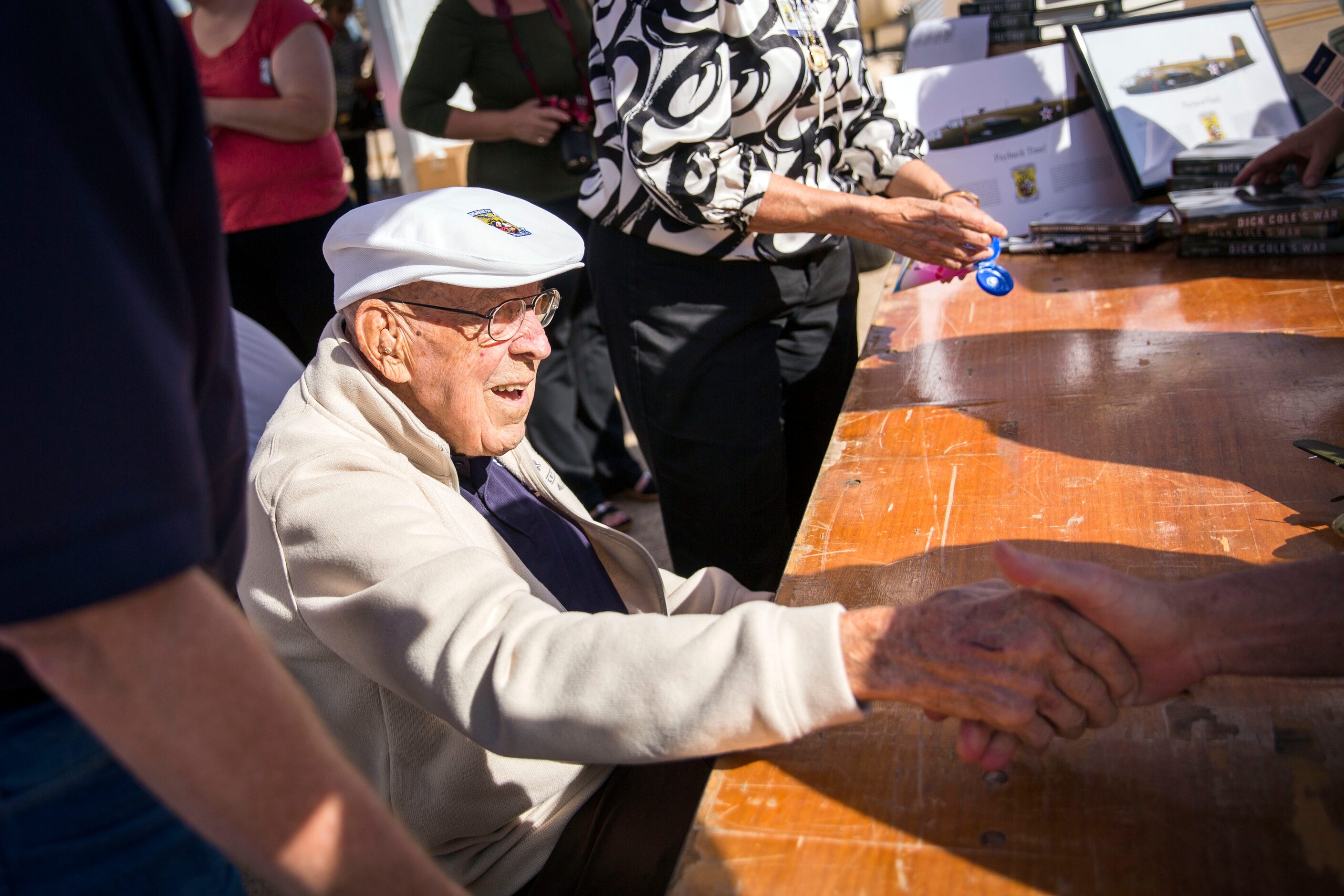 World War II veteran Dick Cole shakes hands during the Commemorative Air Force Wings Over...