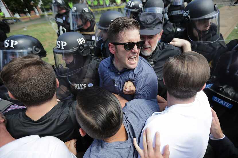 Richard Spencer (center) and his supporters clash with Virginia State Police in Emancipation...