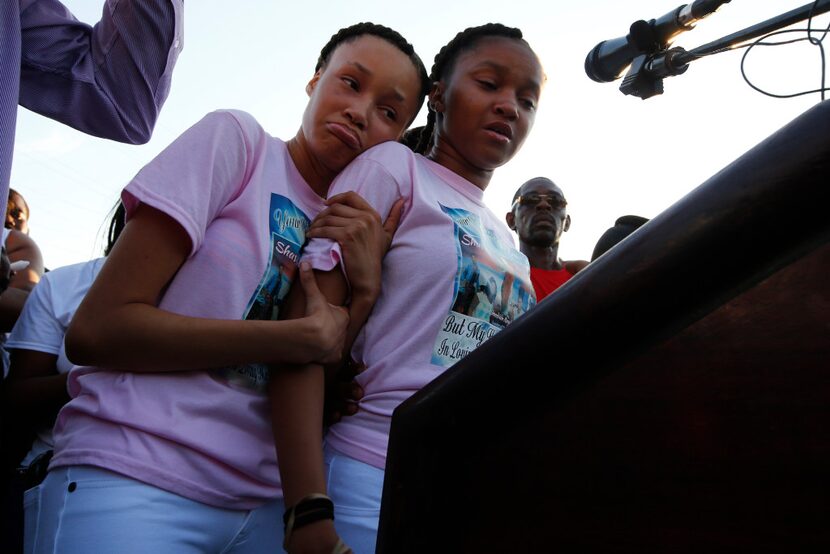 Shavon Randle's sisters Kayla Randle, 14, (right) and Shiniece Richards, 16, speak during a...