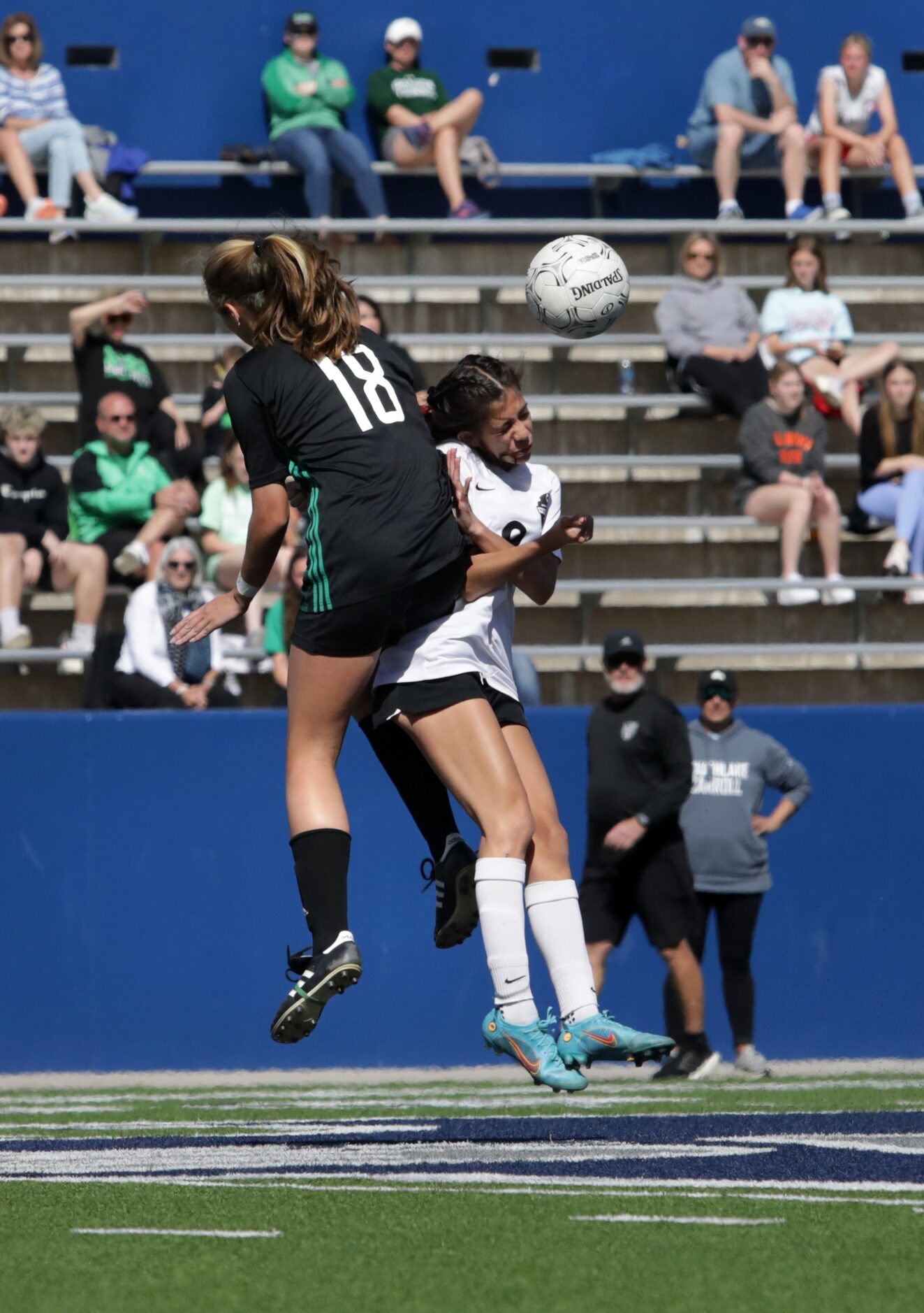 Southlake Carroll player #18, Parker Wilkerson, knocks down Flower Mound Marcus player #9,...