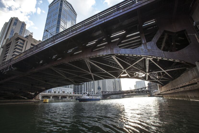 Tour boats glide beneath the Dearborn Street Bridge in Chicago, Ill.
