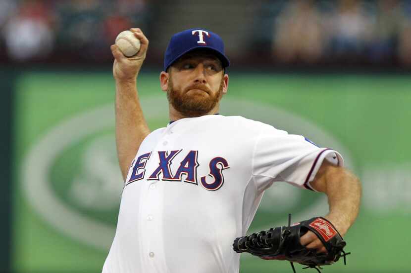 Texas Rangers starting pitcher Ryan Dempster (46) throws a pitch during the second inning of...
