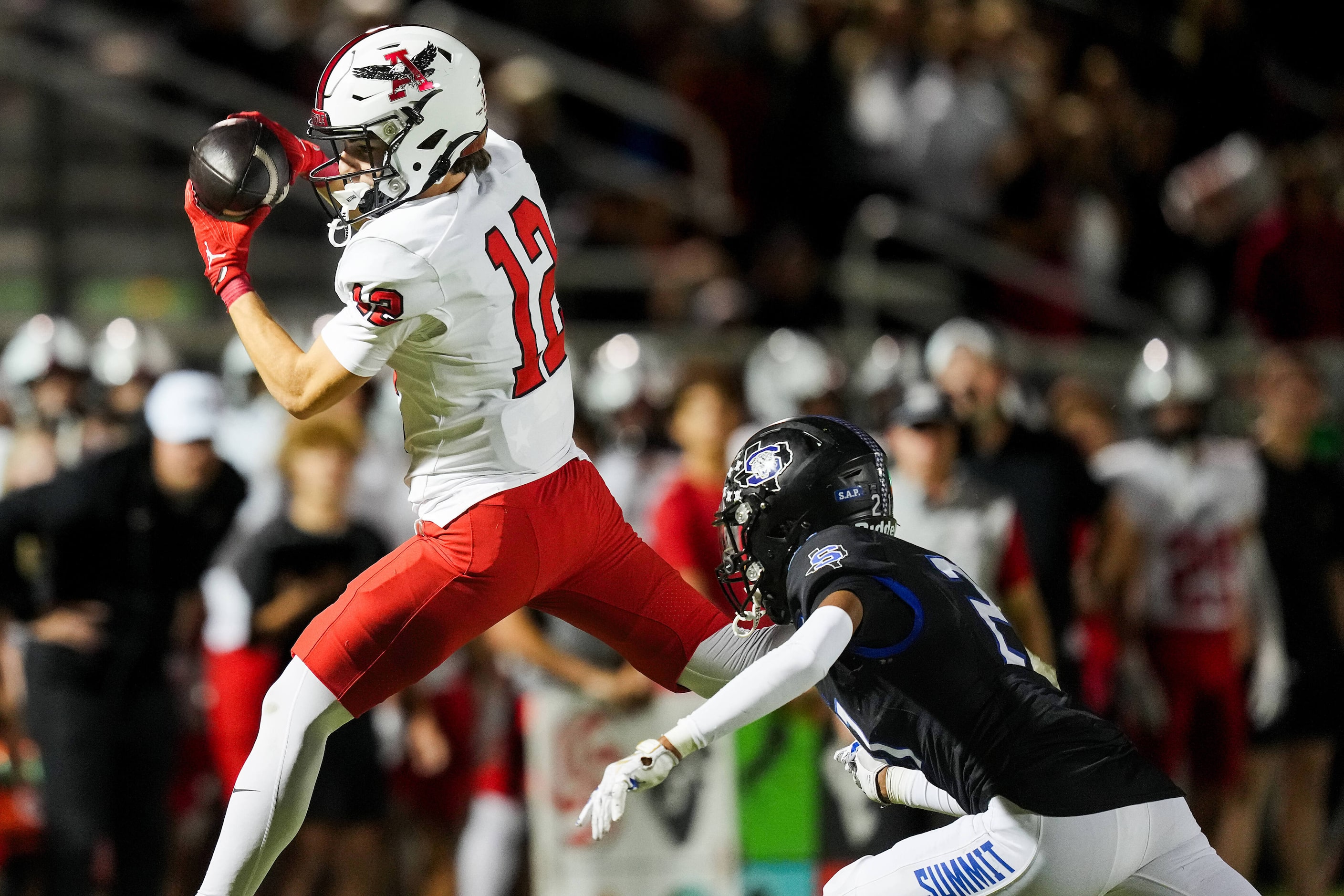 Argyle wide receiver Brooks Bryan (12) catches a pass as Mansfield Summit defensive back...