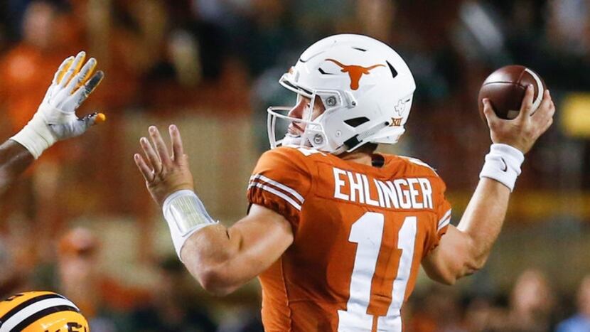 Texas quarterback Sam Ehlinger (11) fires off a pass over LSU linebacker K'Lavon Chaisson...