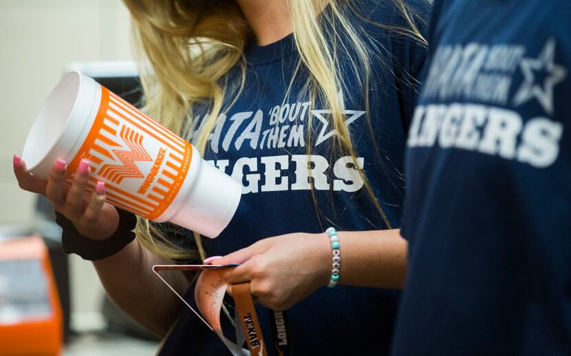 Lone Star High School students wear t-shirts that say "WHATA 'Bout Them Rangers" as they...