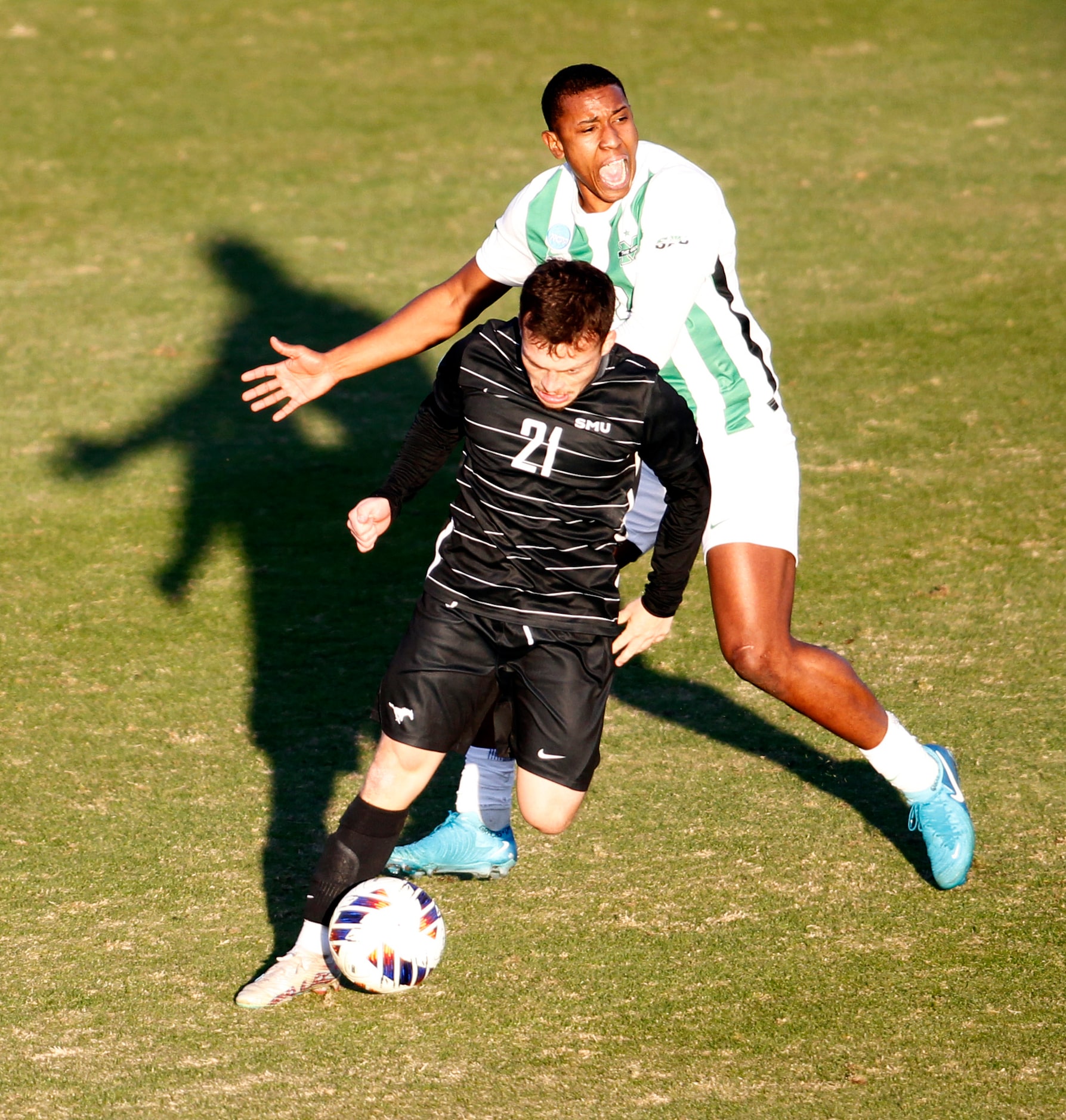 SMU Mustangs midfielder Daniel Felipe Escorcia (21) pulls away from Marshall defenseman Joao...