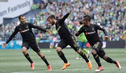 Los Angeles forward Diego Rossi, center, celebrates with Latif Blessing, right, and Steven...