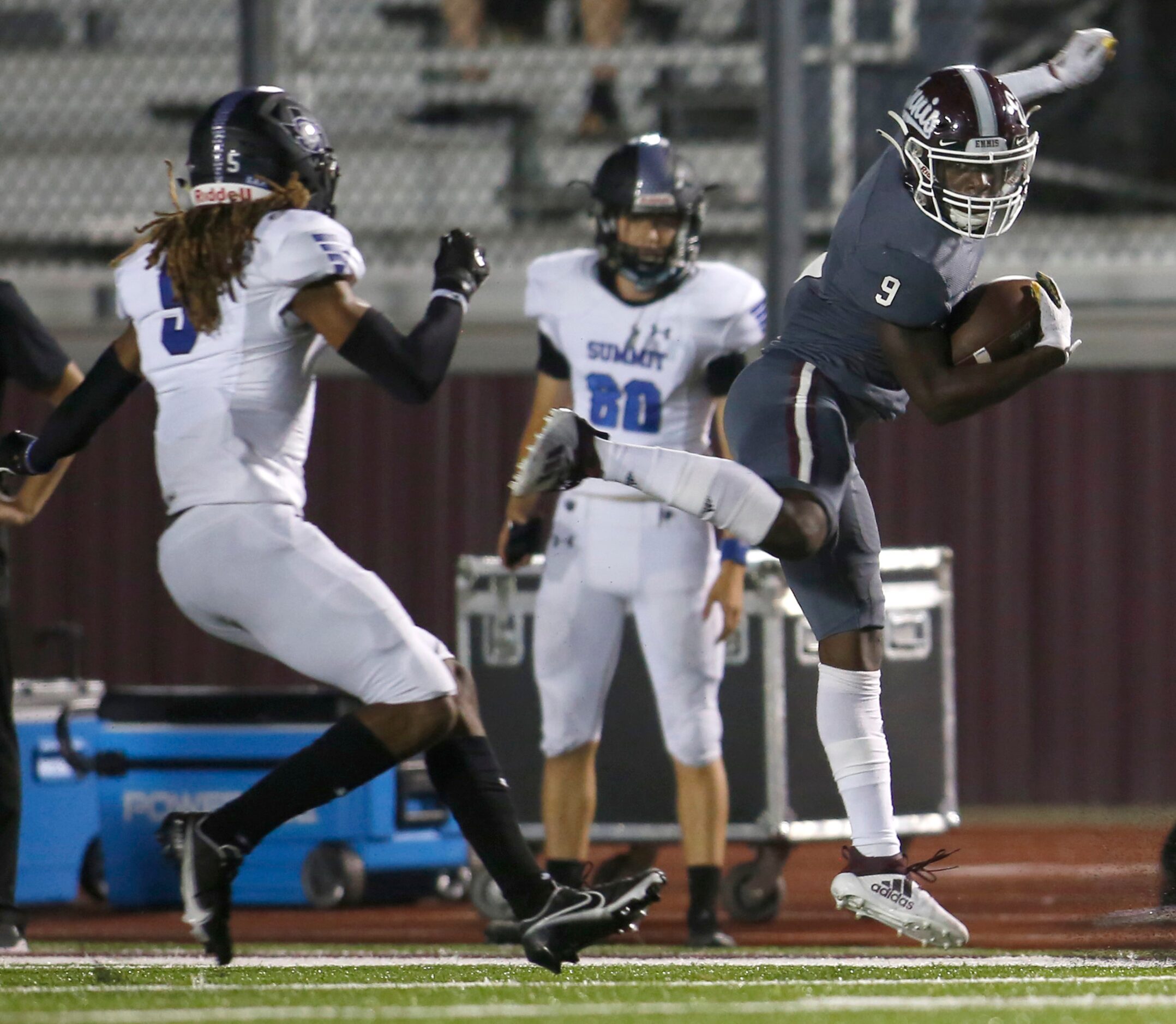 Ennis receiver Devion Beasley (9) appears to be getting a leg up on the competition as he...