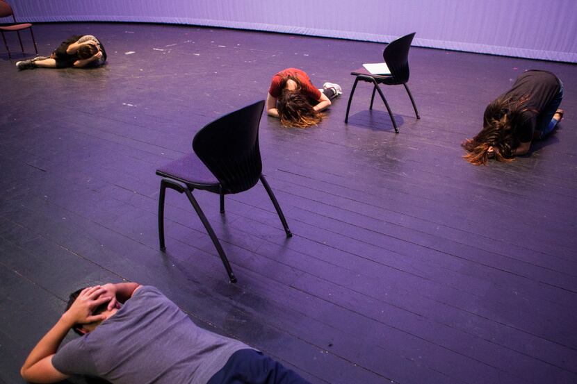 Cast members lay on the floor while practicing the opening scene of Shots Fired on June 30...